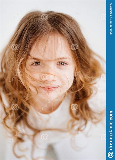 Beautiful Little Girl With Long Hair In White Clothes Stock Image