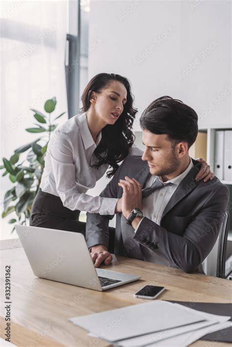 Sexy Secretary Hugging Handsome Boss While Seducing Him In Office Stock Photo Adobe Stock