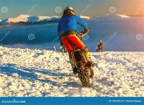 Motorcycle Rider Extreme Sport Biker On Winter Snowy Mountains
