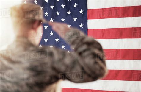 Soldier Saluting American Flag Stock Photo Dissolve