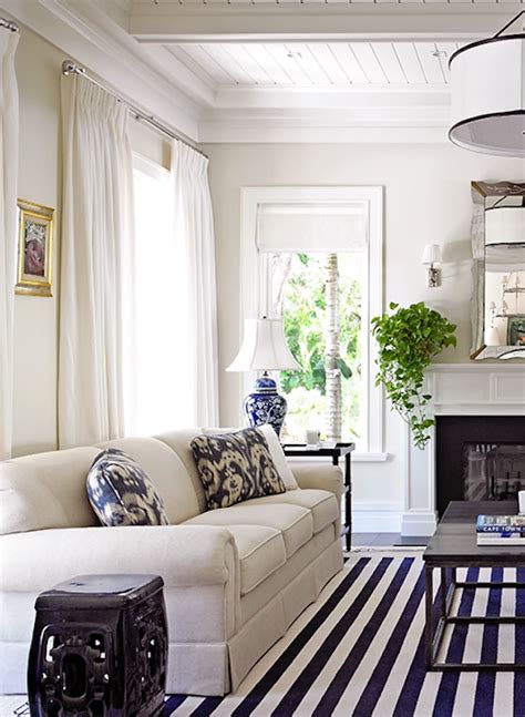 | modern farmhouse décor meets a decidedly coastal feel. Modern coastal living room with a versatile white sofa ...