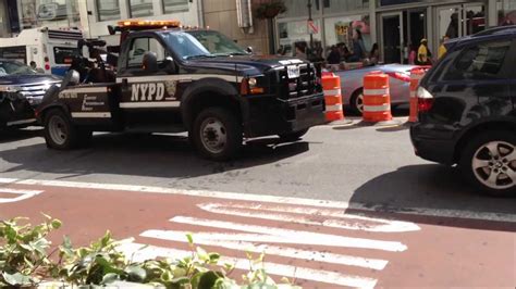 Newer Nypd Tow Truck Towing Car On W 34th St And 7th Ave In Midtown