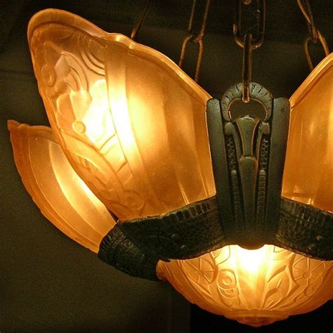 Art deco lighting fixtures are often fitted with decorative pressed and molded glass featuring an array of stylized motifs such as starbursts, waterfalls one of the most popular lighting fixtures of the deco era was the slipper shade fixture. Art Deco Slip Shade Ceiling Light Fixture 1920s-30s $597 ...