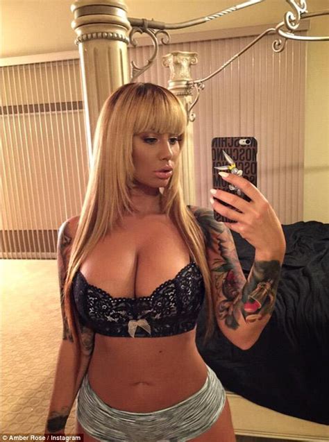 Amber Rose Sports A Blonde Wig And Puts Her Ample Cleavage On Display