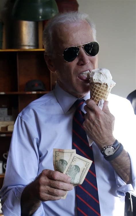 here is a photo of joe biden eating ice cream in his aviators while flashing cash the