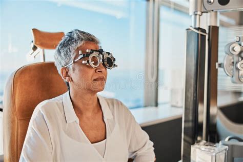 Eye Exam Frame And Senior Woman At Optometrist For Vision Test Trial