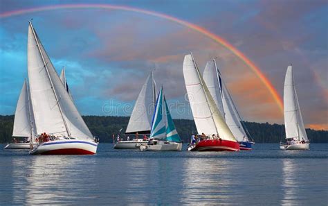 Sailboat Rainbowsailboat Sail Off Into The Sunset On Lake Stock Image
