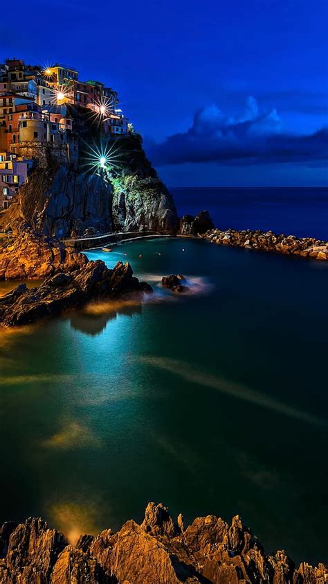 Night Seascape City Italy Lights Rocks Sea Hd Phone Wallpaper