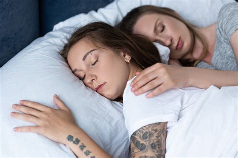 Two Lesbians Embracing While Sleeping Under Blanket In Bed Free Stock Photo And Image