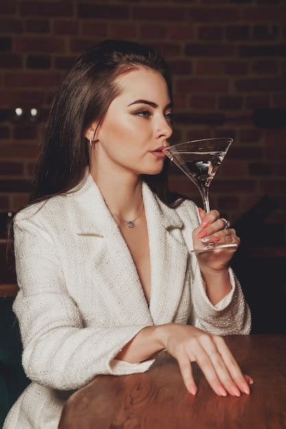 Premium Photo Stylish Sexy Woman With Martini Glass At Table
