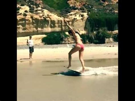 Girl In Bikini Skimboards At The Beach Jukin Licensing