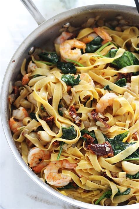 As the weather gets crisper, hearty. Shrimp Tagliatelle with Roasted Garlic, Sun-Dried Tomatoes ...