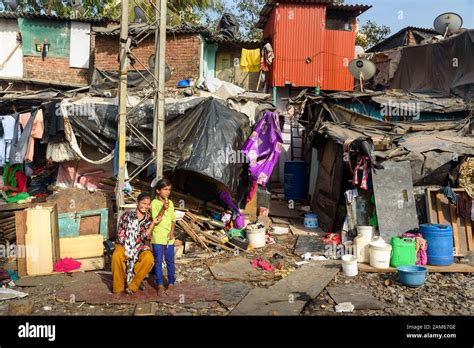 Indian Poor People Live Near Suburban Railway In Dharavi Slum At Mumbai