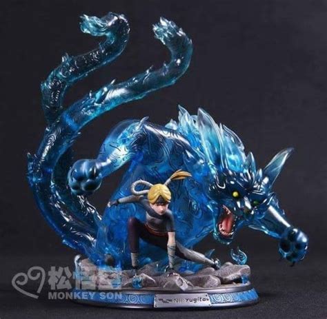 A Figurine Is Shown With A Blue Dragon On Its Back Legs