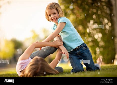 Two Sisters Playing In Backyard Stock Photo Alamy