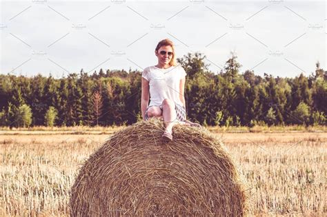 Girl On A Hay Bale Holiday Stock Photos ~ Creative Market