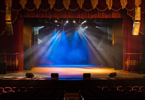 An Empty Stage Of The Theater Lit By Spotlights And Smoke Stock Photo