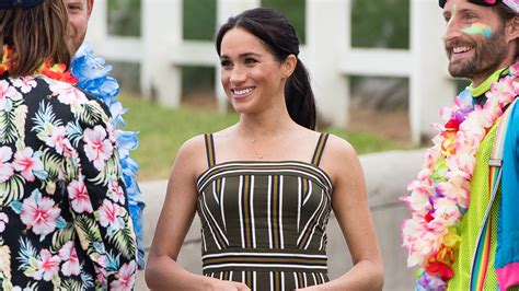 Meghan Markle Hits The Beach—and Wards Off Bad Vibes—in A Striped Maxi