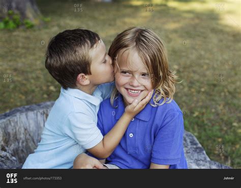 Babe Kissing His Brother Offset Stock Photo OFFSET