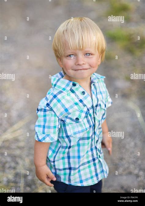 Portrait Of Blonde Little Boy Posing Outside Stock Photo Alamy