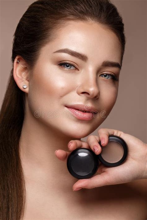 Beautiful Young Girl With Natural Nude Make Up With Cosmetic Tools In Hands Beauty Face Stock