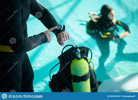 Diver And Divemaster Mark The Dive Time Diving Stock Image Image Of