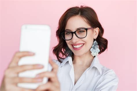 Premium Photo Smiling Brunette Woman Taking Selfie