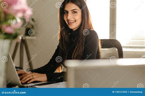 Confident Young Businesswoman At Her Desk Stock Image Image Of Young