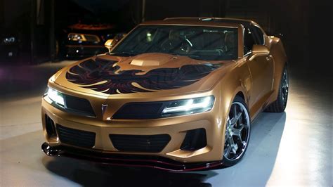 A Gold Sports Car With Flames Painted On It