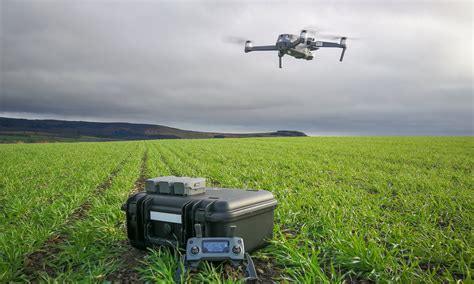A Farmer Monitoring Crops With Drones Skippy Scout