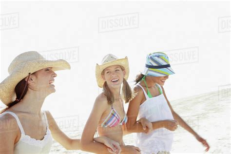 Friends Walking On Beach Stock Photo Dissolve
