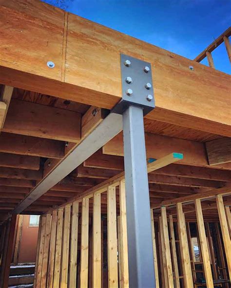 Steel construction of an industrial building under construction. Steel beam and column do some heavy lifting to help ...