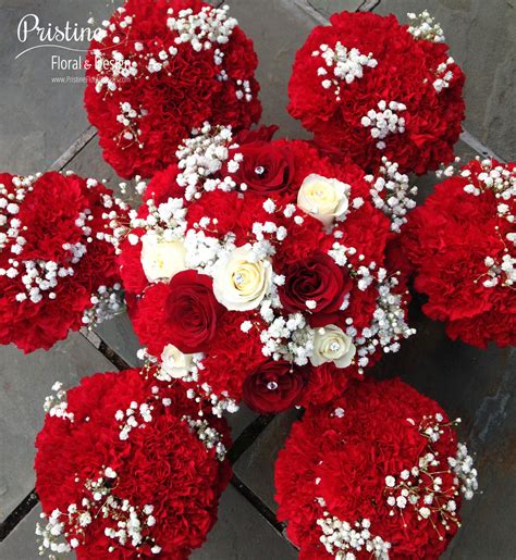 Bridal Bouquet Designed Using Red Roses White Roses Carnations And Baby