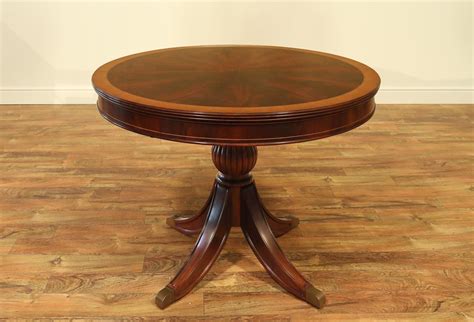 Measuring 29.5 h x 47.5 w x 47.5 d overall, this dining table comfortably seats six. 48 inch Round Mahogany Pedestal Table with Leaf