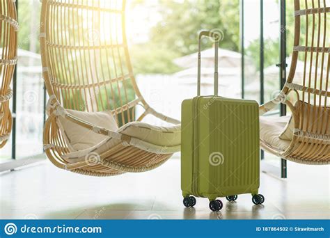 Green Luggage With Rattan Hanging Chair Focus Front Luggage Stock