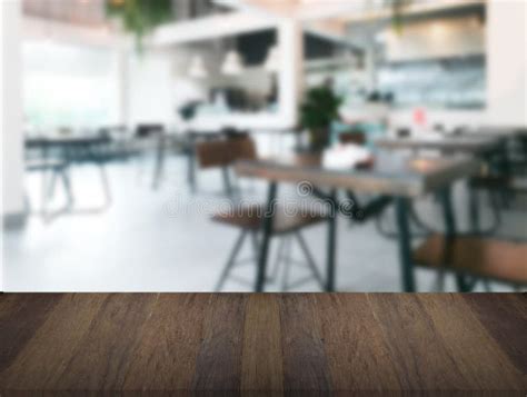Wood Table Top Counter Bar On Blur Modern Cafe Background Stock Image