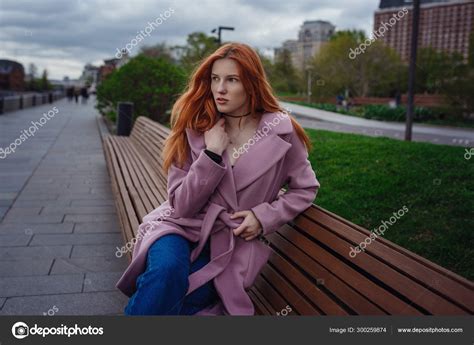 Portrait Of Beautiful Redhair Woman Walking The City Park Stock