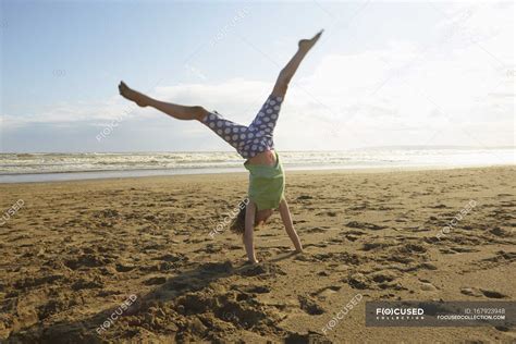 Girl Doing Handstand On Beach Camber Sands Kent Uk — Travel Summer