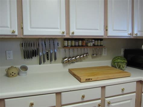 Make over your cabinets with some of these creative solutions. The Saucy Kitchen: Storage Solutions - Mini Pot Rack