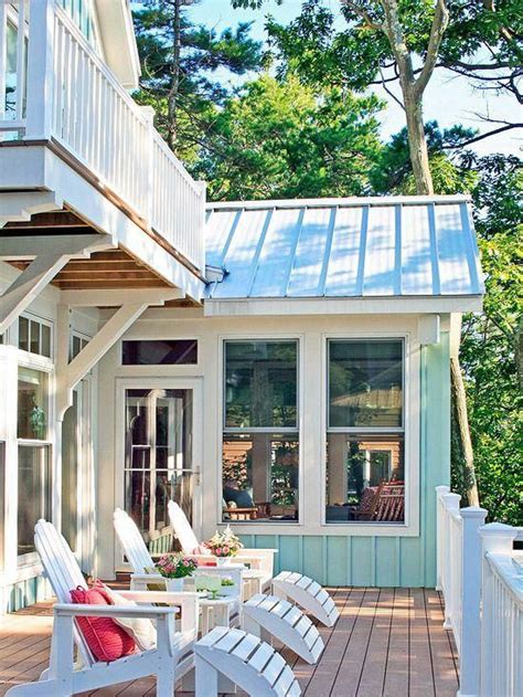 A Porch With White Chairs And A Hot Tub On The Deck Next To It Is