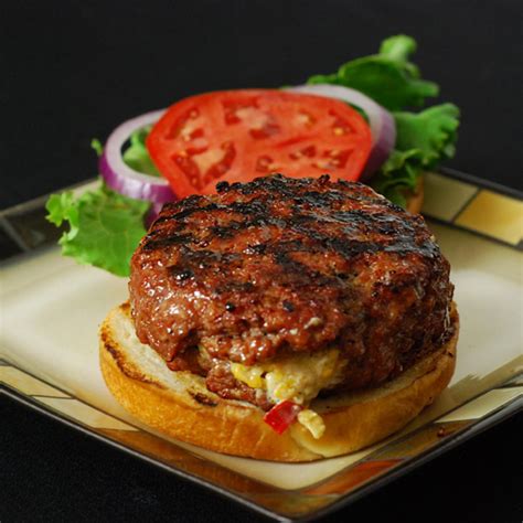 The cheese is usually added to the cooking hamburger patty shortly before serving, which allows the cheese to melt. Pimento Cheese Stuffed Burger