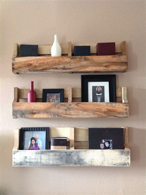 Wall shelves can be used to keep books, picture frames, and other small items. Reclaimed pallet shelves set of 3 by DelHutsonDesigns on Etsy
