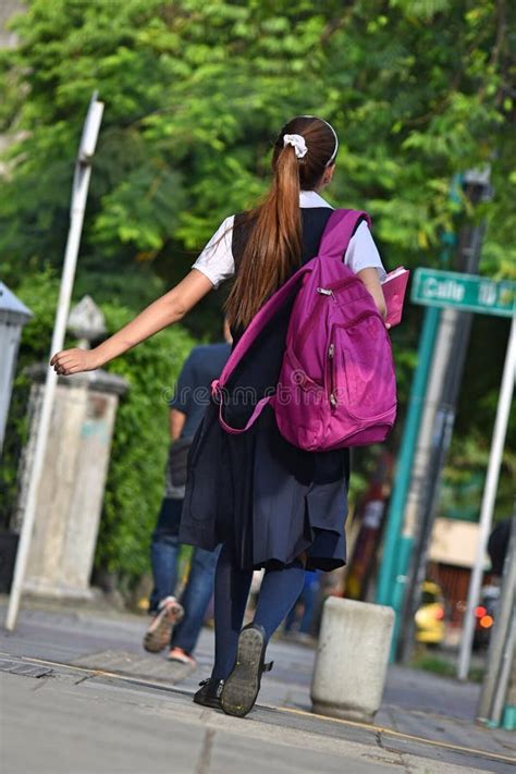School Girl With Bookbag Walking On Sidewalk Stock Image Image Of
