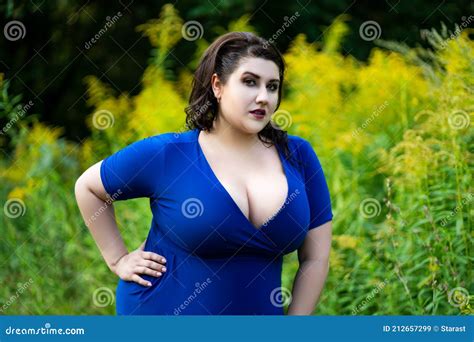 Plus Size Model In Blue Dress With A Deep Neckline Outdoors Beautiful Fat Woman With Big