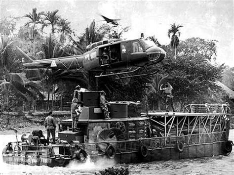 Huey Hovering Above A Boat Viet Nam Vietnam History Vietnam War