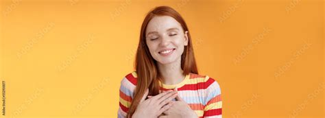 Happy Romantic Delighted Sighing Young Lovely Redhead Girlfriend Smiling Broadly Touching Heart