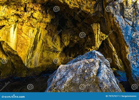 Closeup View On Rocky Mountain With Cave Stock Image Image Of Yellow