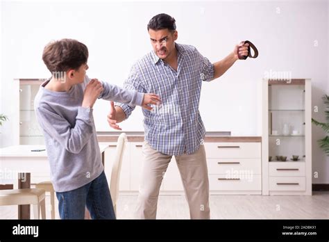Father Beating And Punishing His Sone Stock Photo Alamy