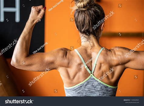 Muscular Woman Flexing Her Muscles Fitness Stock Photo 1149569501