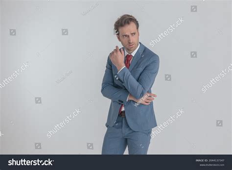 Cool Frowning Man Blue Suit Folding Stock Photo 2044137347 Shutterstock